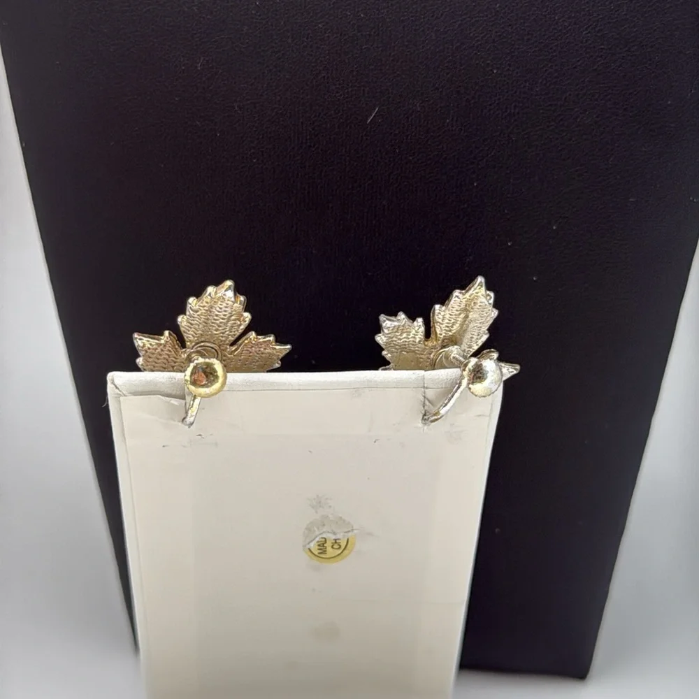 Gold tone textured leaf rhinestone accent screw back statement earrings